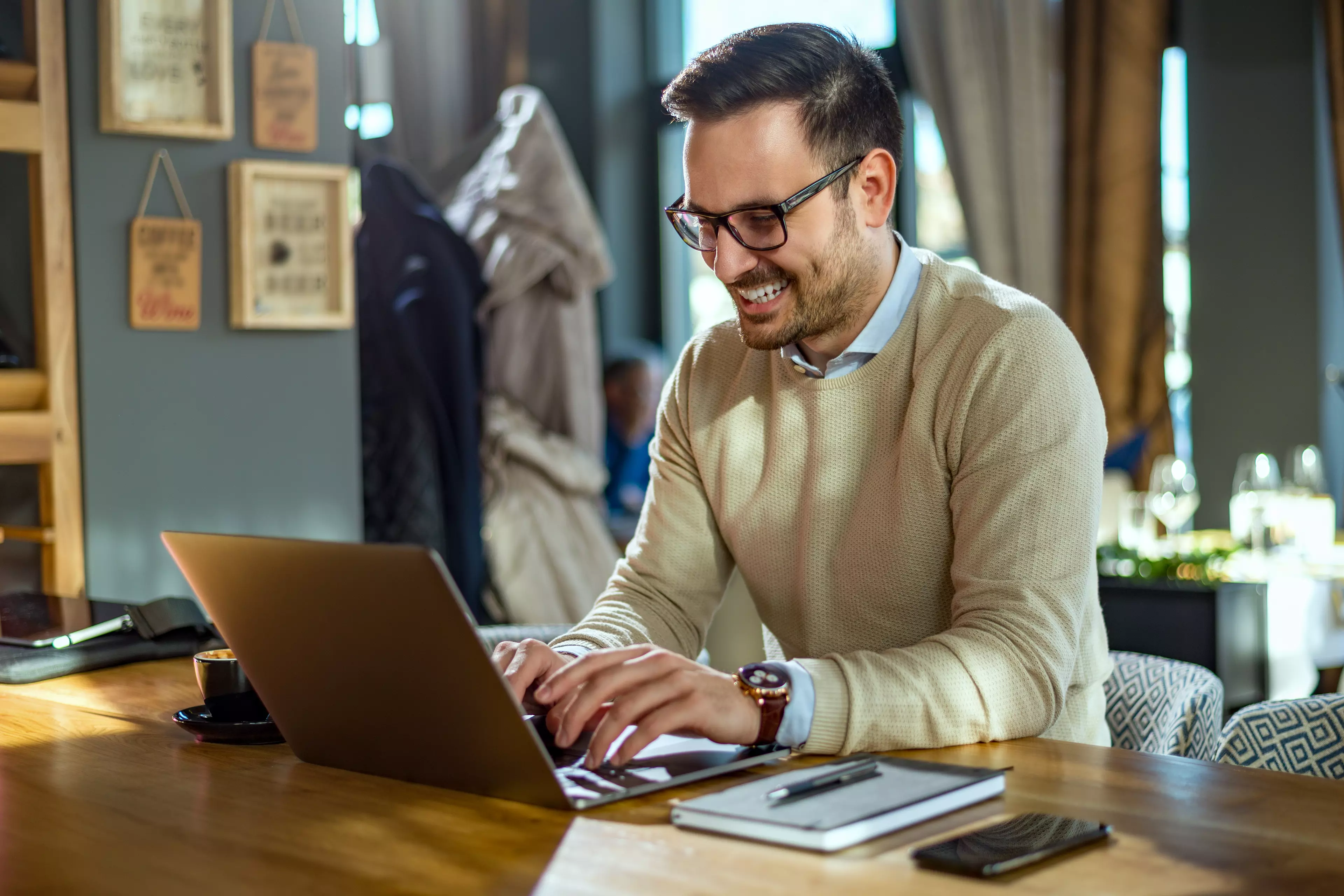 Smiling man takin an online test at home