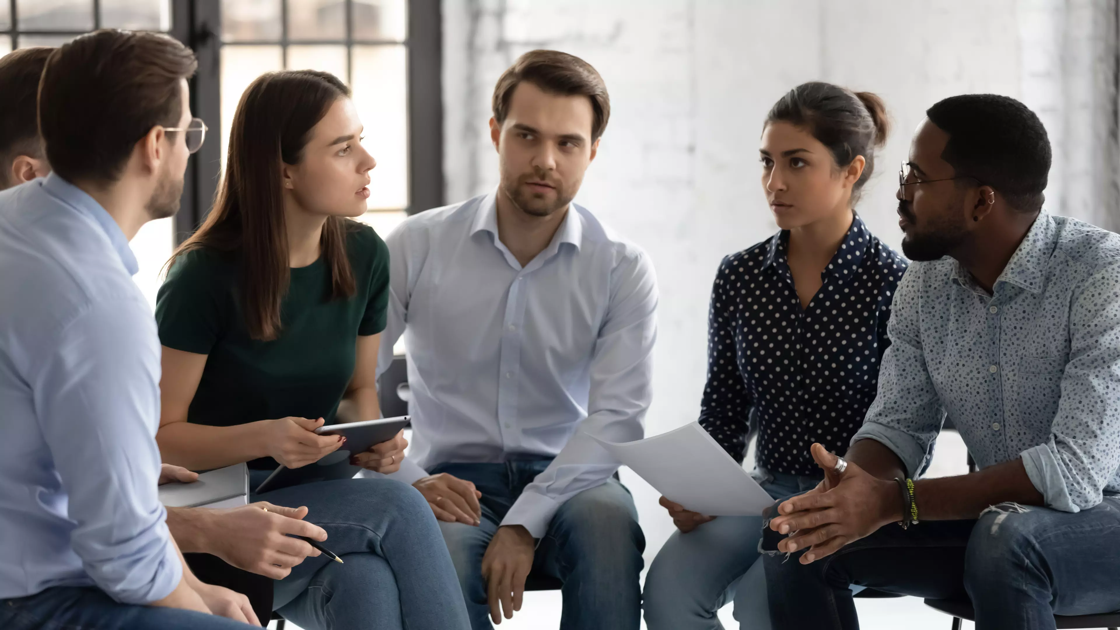 Group of coworkers during a team meeting.