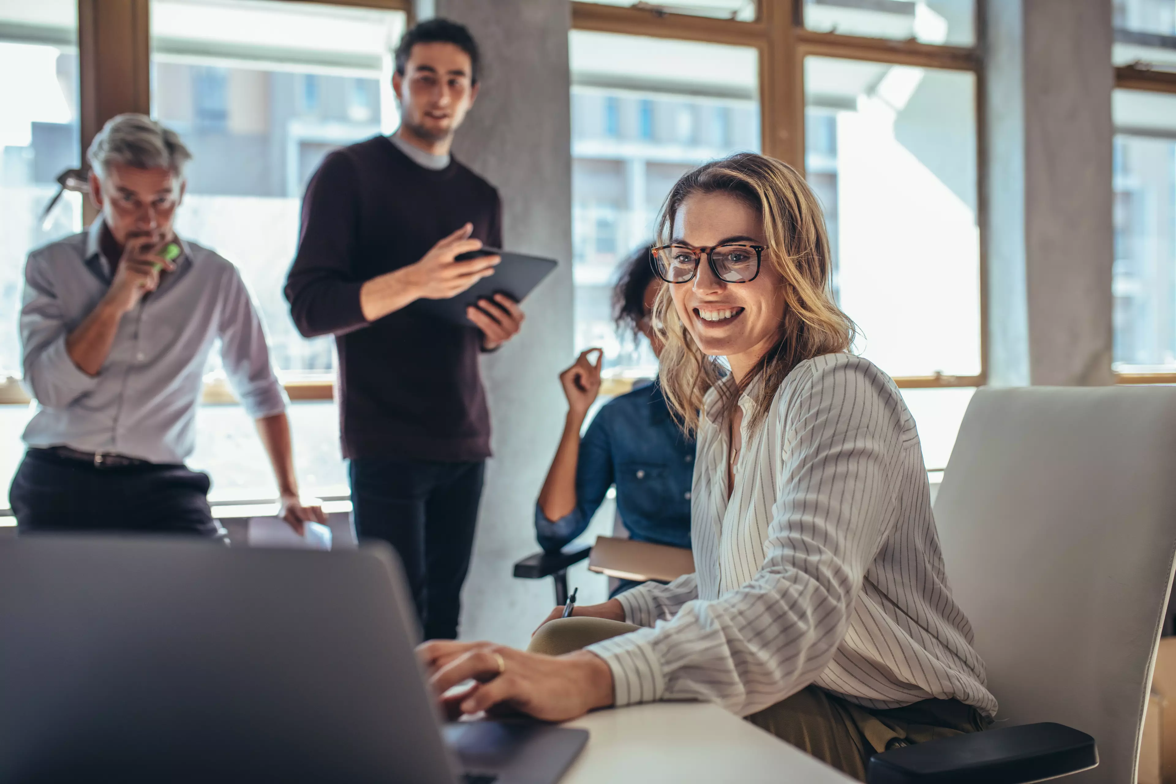  Group of happy people during an office meeting.